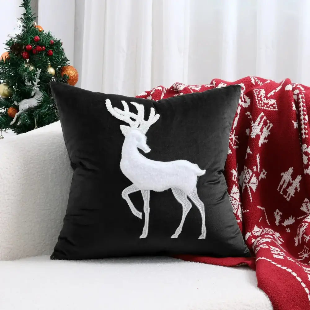 Black velvet pillow cover with white embroidered christmas elk design from decorbites christmas elk collection