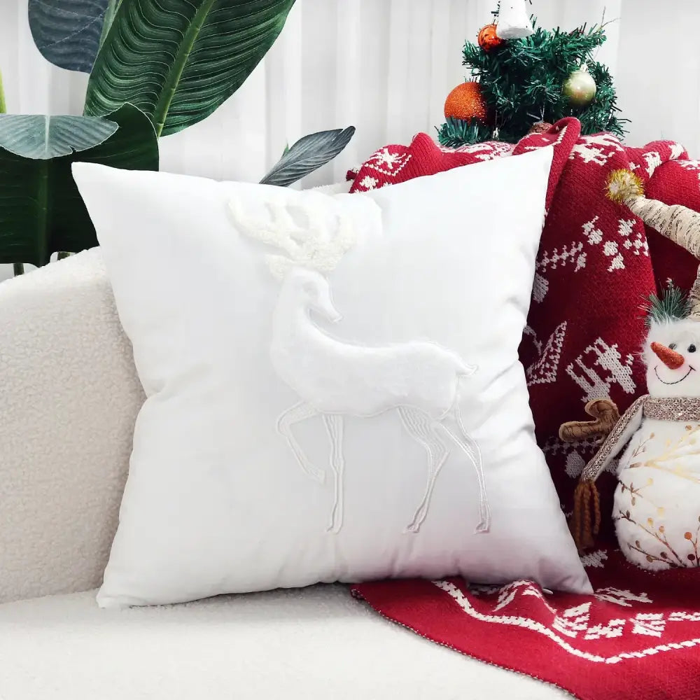 White cushion pillow cover with raised embroidered christmas elk design from decorbites christmas elk collection