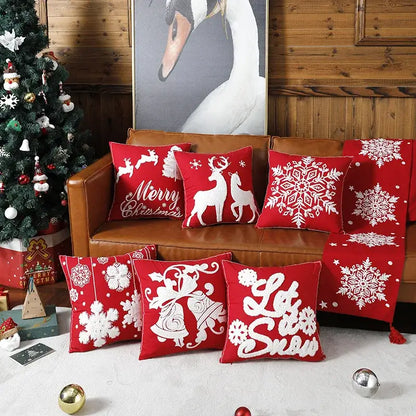 Red christmas embroidered cotton pillow covers by decorbites featuring snowflakes elk bells and holiday greetings