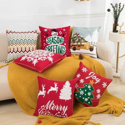 Red decorbites christmas embroidered cushion cover with snowflake and reindeer on mustard yellow knitted blanket