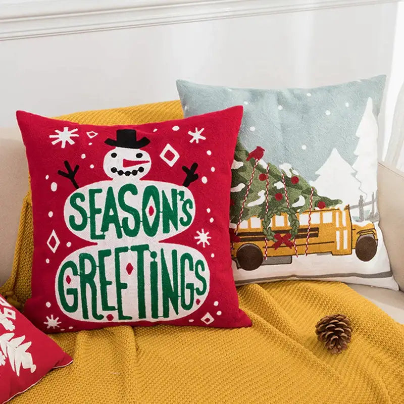 Red decorbites christmas embroidered cushion cover 45x45cm featuring snowman green lettering and white snowflakes on plush fabric