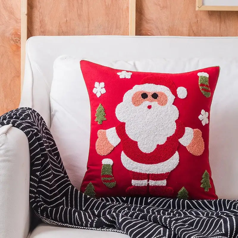 Red decorbites christmas embroidered cushion cover featuring a fluffy santa claus with trees and snowflakes design