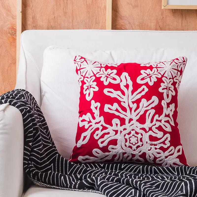 Red cushion cover with white embroidered floral and snowflake patterns decorbites christmas embroidered cushion