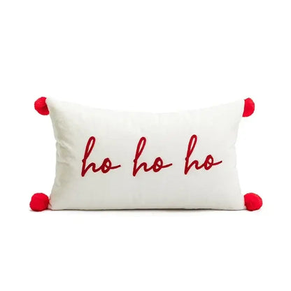 White rectangular pillow cover with red embroidered ho ho ho text and pom-poms from decorbites christmas embroidered collection