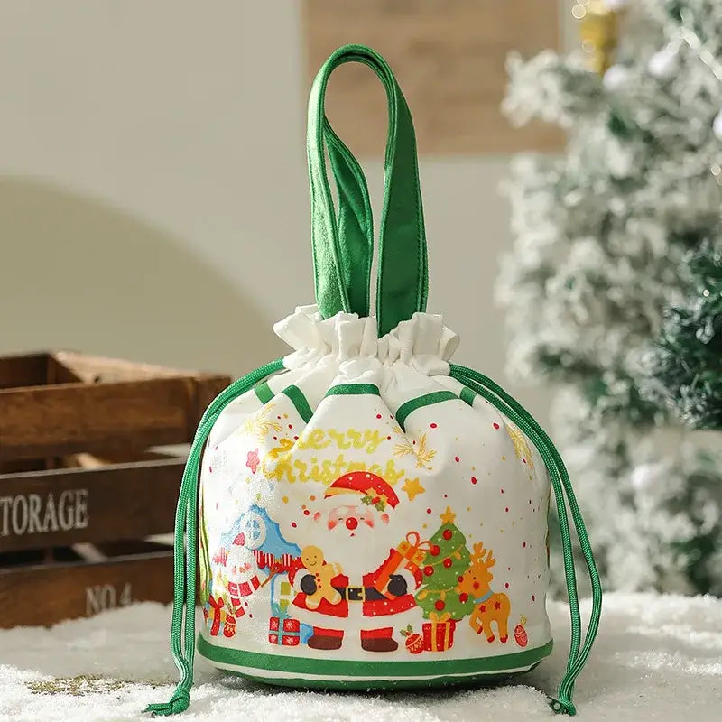 White christmas-themed decorbites christmas eve apple bag with green trim featuring santa claus and reindeer print
