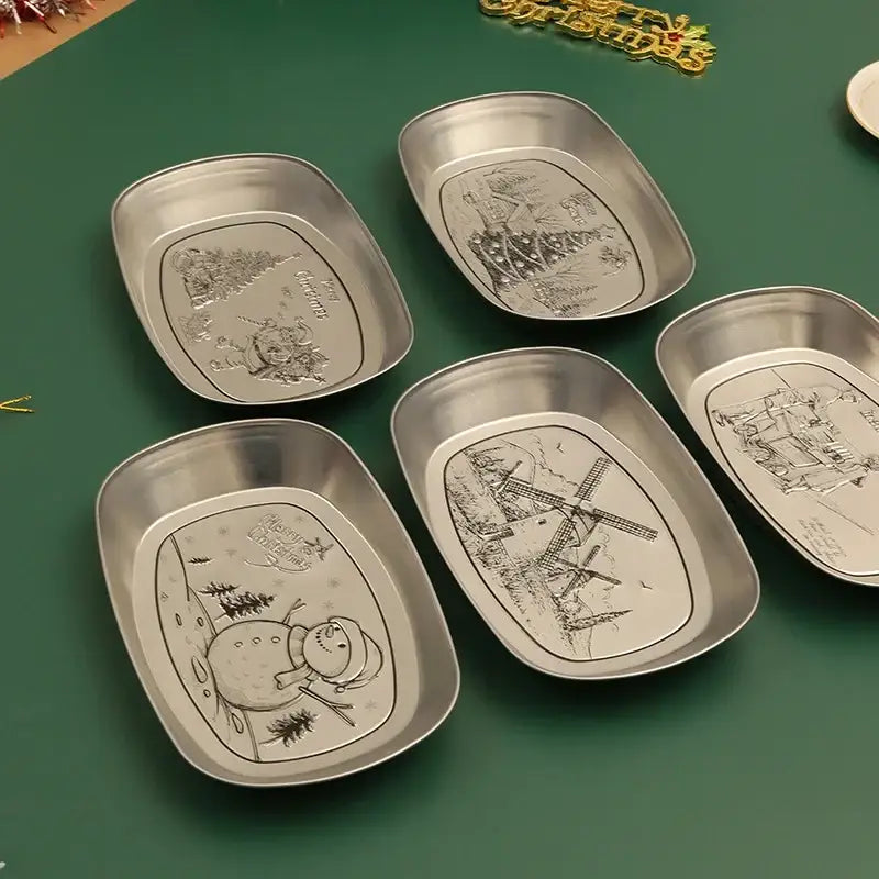 Set of five silver-toned metal christmas fruit trays with embossed Santa Claus and snowman holiday illustrations