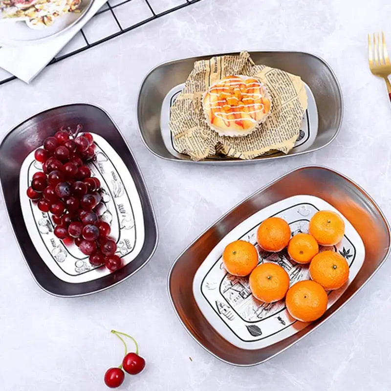 Rectangular ceramic christmas fruit tray with glossy finish and black and white santa claus snowman print pattern