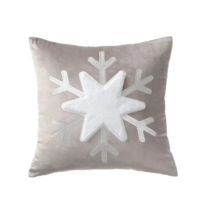 A plush gray pillow cover with a white textured snowflake appliqué from decorbites christmas jacquard elk collection