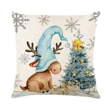 Beige linen pillow cover with decorbites christmas letter print featuring a cartoon reindeer by a christmas tree