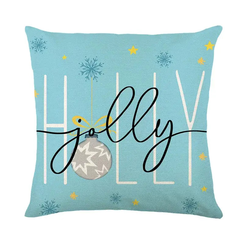 Light blue linen pillow cover featuring a decorbites christmas letter print with jolly holly design and festive ornament