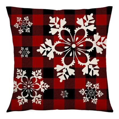 Red and black plaid cushion cover with white snowflake designs made of decorbites christmas linen for sofa decor