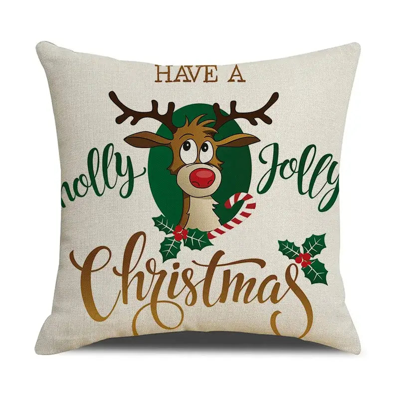 Beige linen christmas throw pillow with cartoon reindeer and holly in green and gold lettering decorbites christmas linen cushion cover for festive home decor
