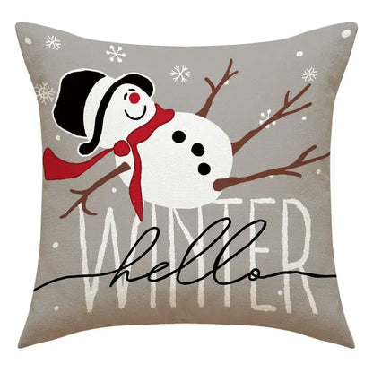 Gray throw pillow with cheerful snowman print wearing black hat and red scarf for santa claus living room decor
