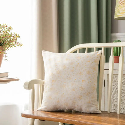 Cream-colored cushion with subtle gold floral embroidery on wooden bench for decorbites christmas plaid cushion cover