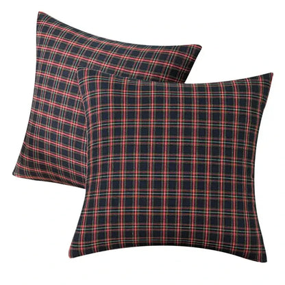 Square pillow covers with a classic decorbites christmas plaid pattern in red green and white on navy for holiday decor