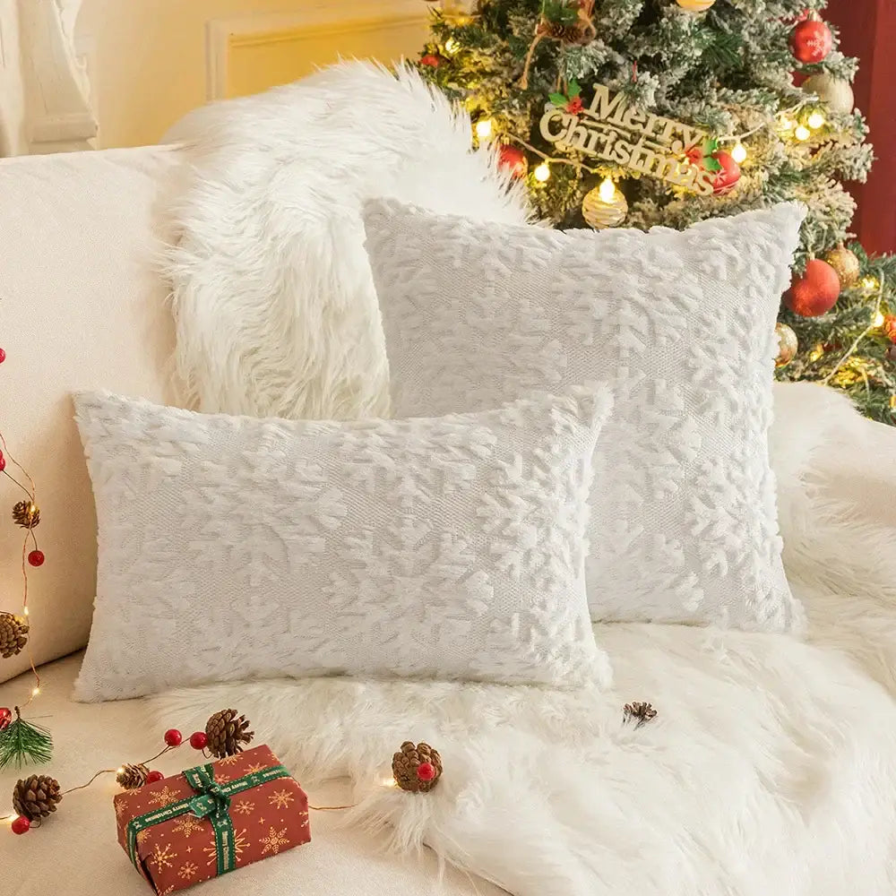 White textured decorbites christmas plush pillow case set with subtle snowflake pattern on fluffy white surface