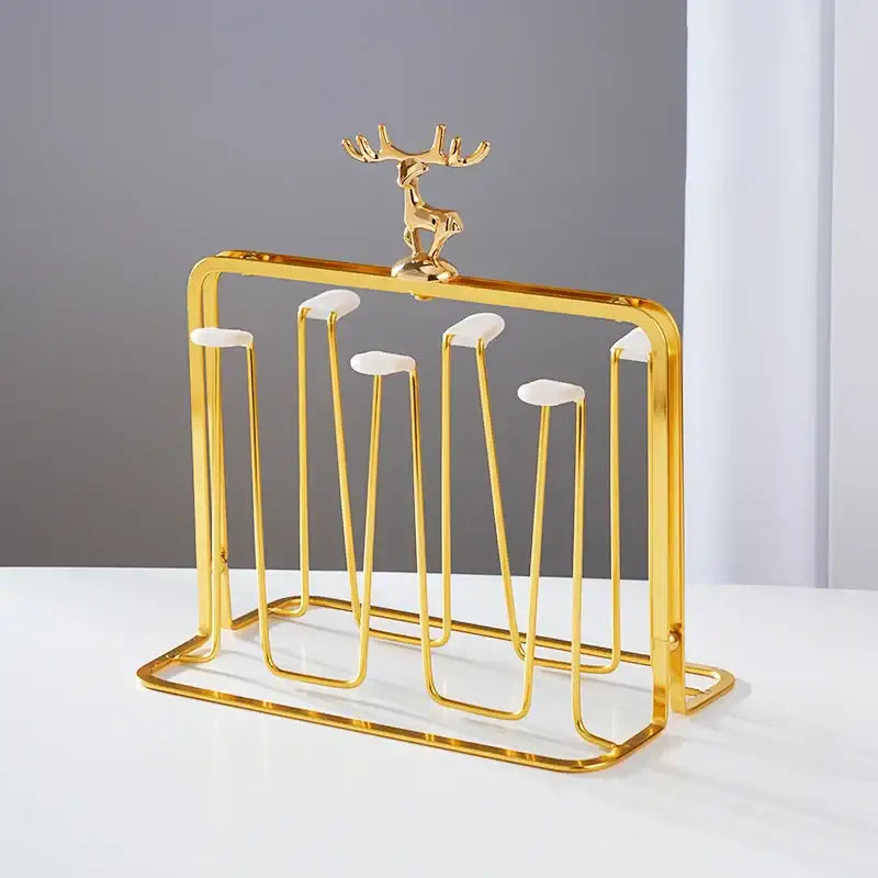Golden metal cups holder set with deer figurine and white ceramic accents for drying glass cups by decorbites