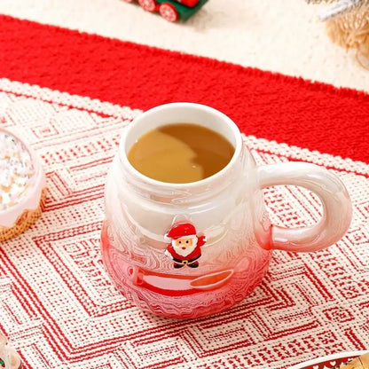 A translucent red and white ceramic mug with santa claus design filled with warm beverage decorbites christmas santa ceramic mug