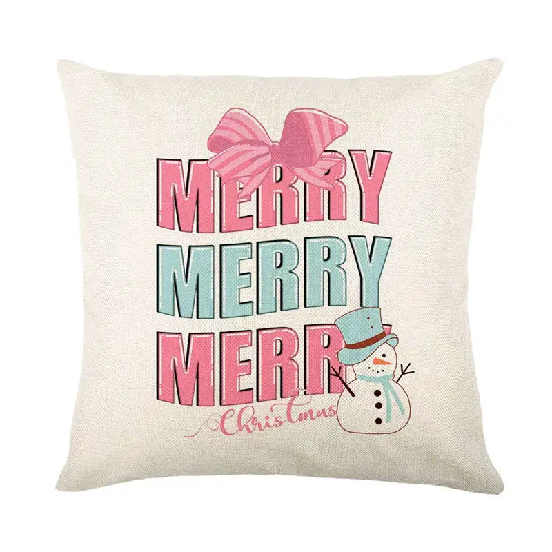 Beige linen pillow cover with merry merry merry christmas design, striped pink bow, and snowman in blue hat by decorbites christmas santa