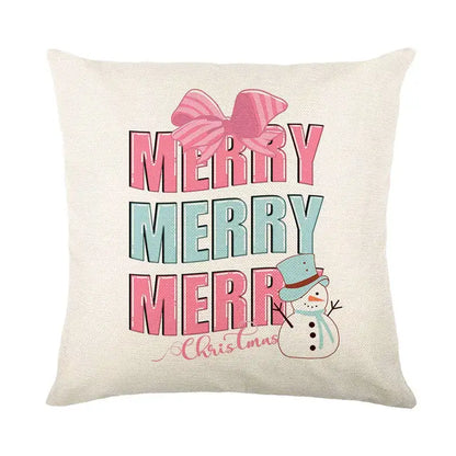 Beige linen pillow cover with merry merry merry christmas design, striped pink bow, and snowman in blue hat by decorbites christmas santa