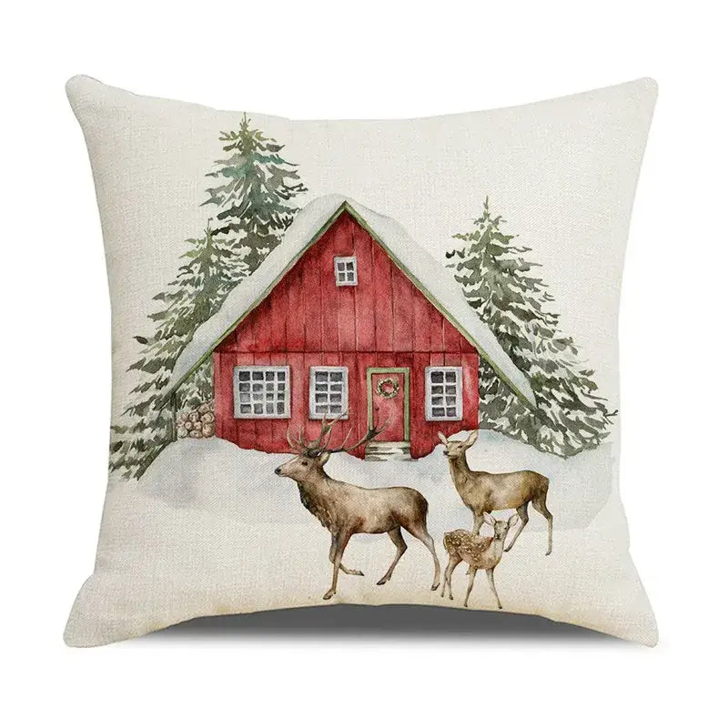 Beige linen pillow cover with decorbites christmas snow elk design featuring red cabin and deer in snowy landscape