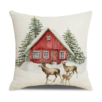 Beige linen pillow cover with decorbites christmas snow elk design featuring red cabin and deer in snowy landscape