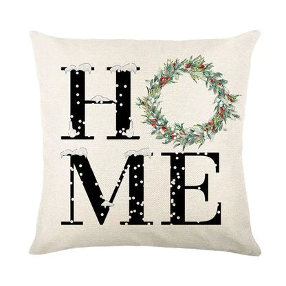 Beige linen pillow cover with black home text and green wreath design from decorbites christmas snow elk collection