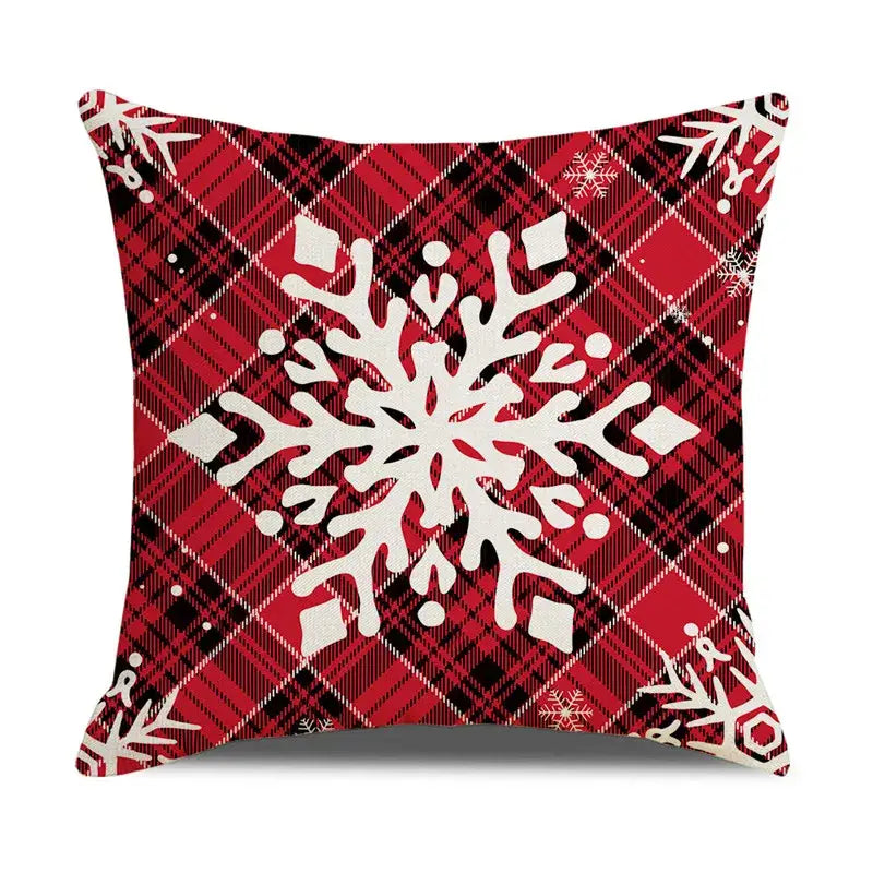 Red and black plaid pillow cover with large white snowflake design from decorbites christmas snow elk collection
