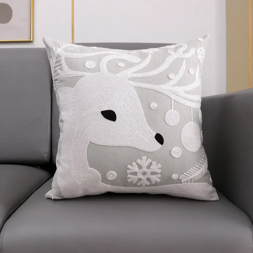 Soft gray cushion cover with white embroidered snowflake deer and festive ornaments by decorbites christmas snowflake