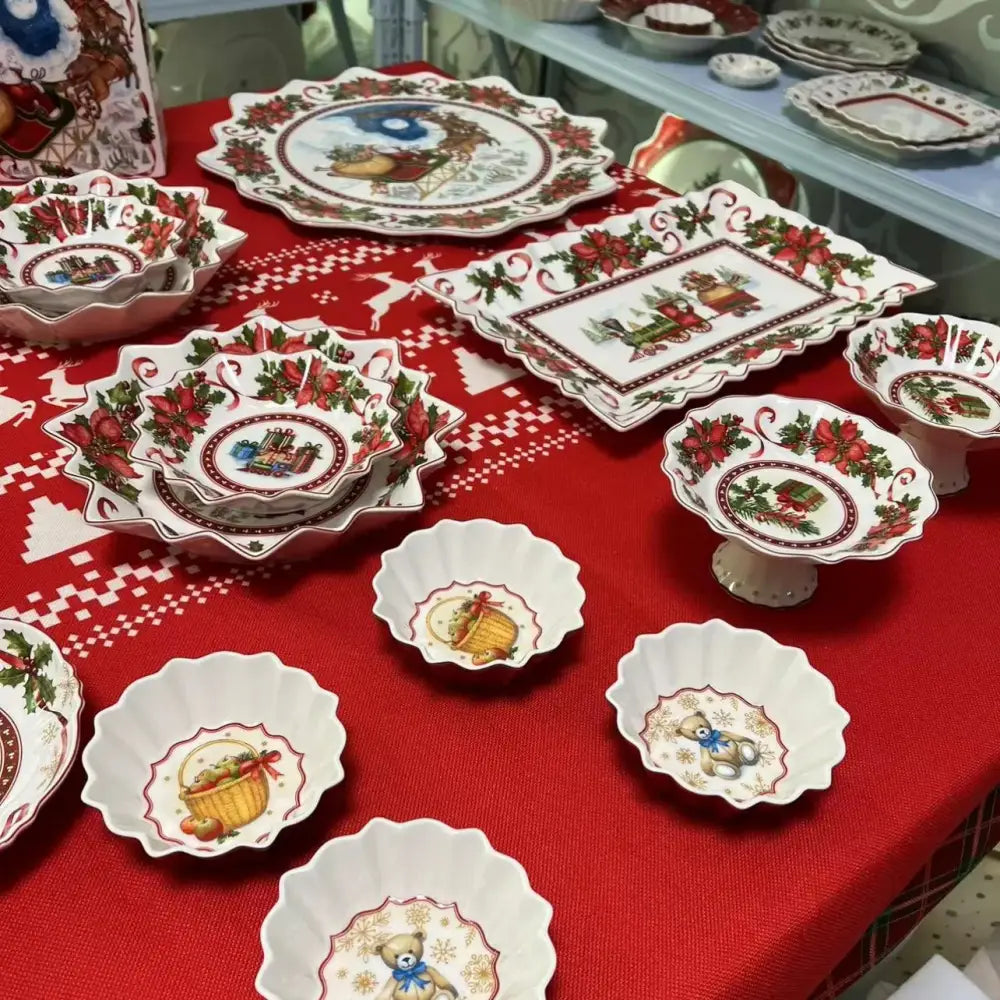 Set of white ceramic decorbites christmas tableware featuring red poinsettias holly sleighs gifts and teddy bears designs