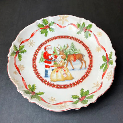 White ceramic christmas plate from decorbites christmas tableware featuring santa claus reindeer holly and gold snowflakes