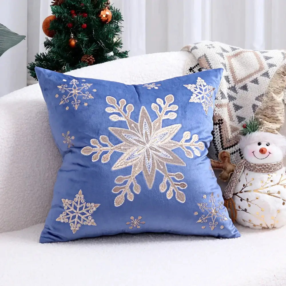 Blue velvet cushion cover with intricate silver and beige embroidered snowflakes for christmas tree decor