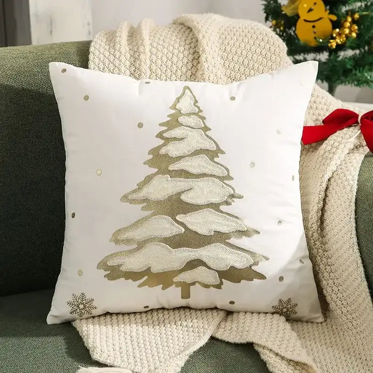 White throw pillow cover with embroidered metallic gold christmas tree and snowflake accents by DecorBites™