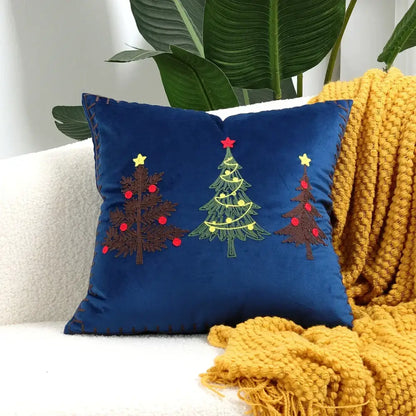 Deep blue velvet christmas tree cushion cover with embroidered brown green and yellow trees and red star toppers