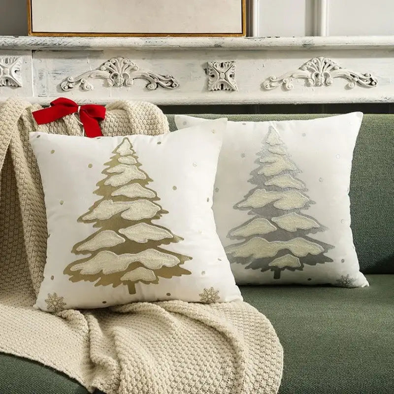 White throw pillows with embroidered gold and silver snow-covered christmas tree cushion cover decorative dots