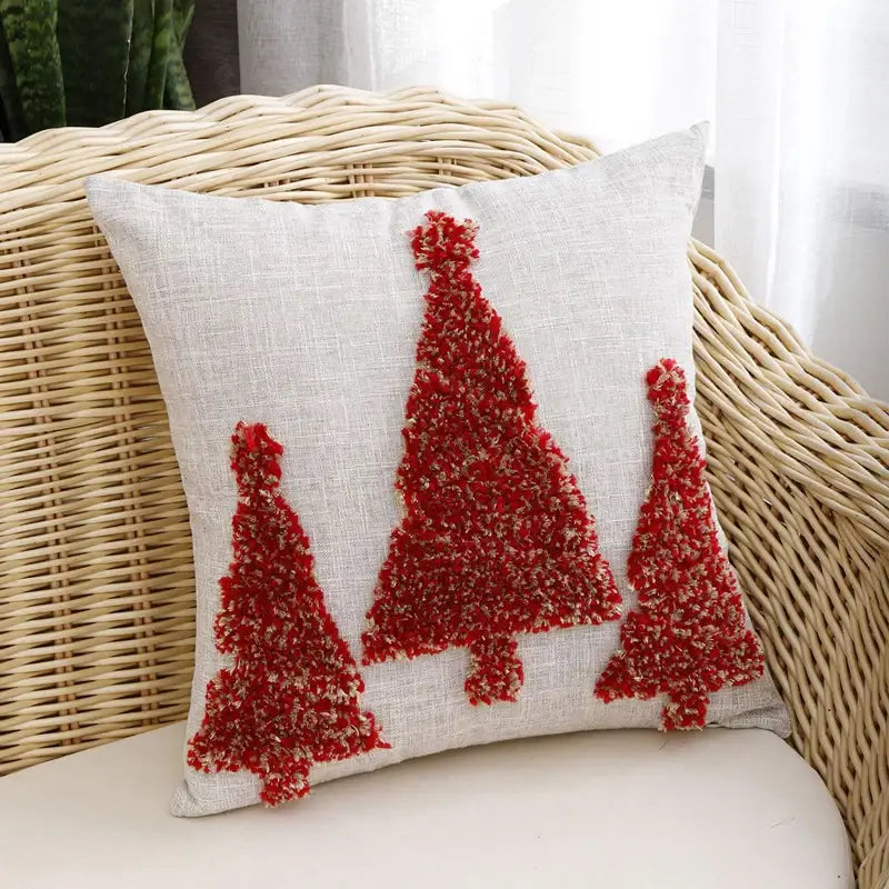 Beige linen pillow cover with three red textured christmas tree appliqués from decorbites christmas tree gold collection