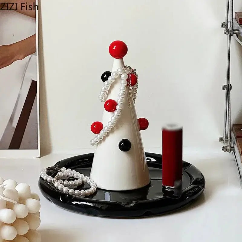 White ceramic DecorBites christmas tree jewelry stand with red and black spherical accents for earring and necklace storage