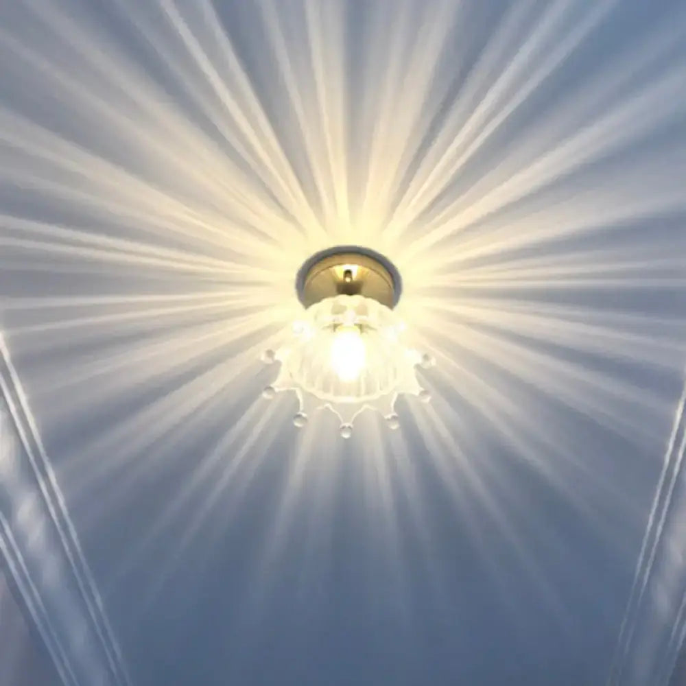 Warm glowing glass ceiling light fixture with brass lamp holder from DecorBites for corridor lighting