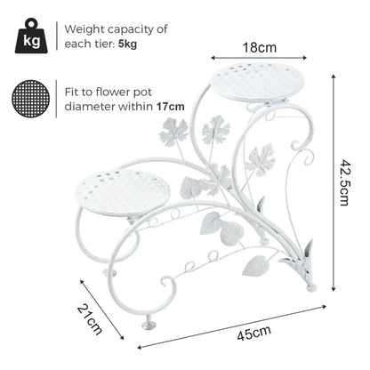 White wrought iron classic tall plant stand with decorative leaf and vine motifs and three tiers for indoor outdoor use