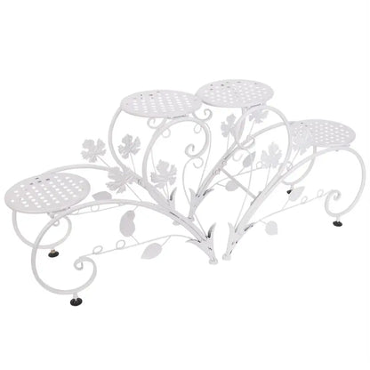 White wrought iron classic tall plant stand with floral and leaf motifs and five perforated circular shelves by DecorBites