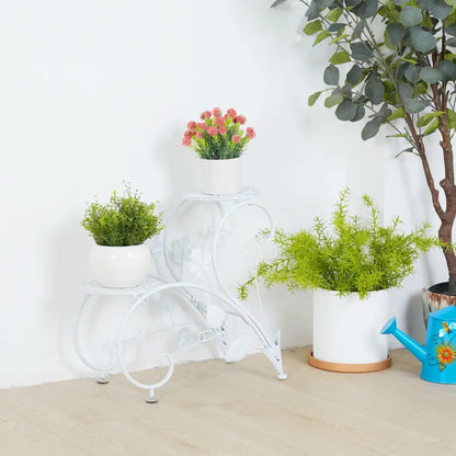White wrought iron classic tall plant stand with curved decorative legs and three tiers for indoor and outdoor use