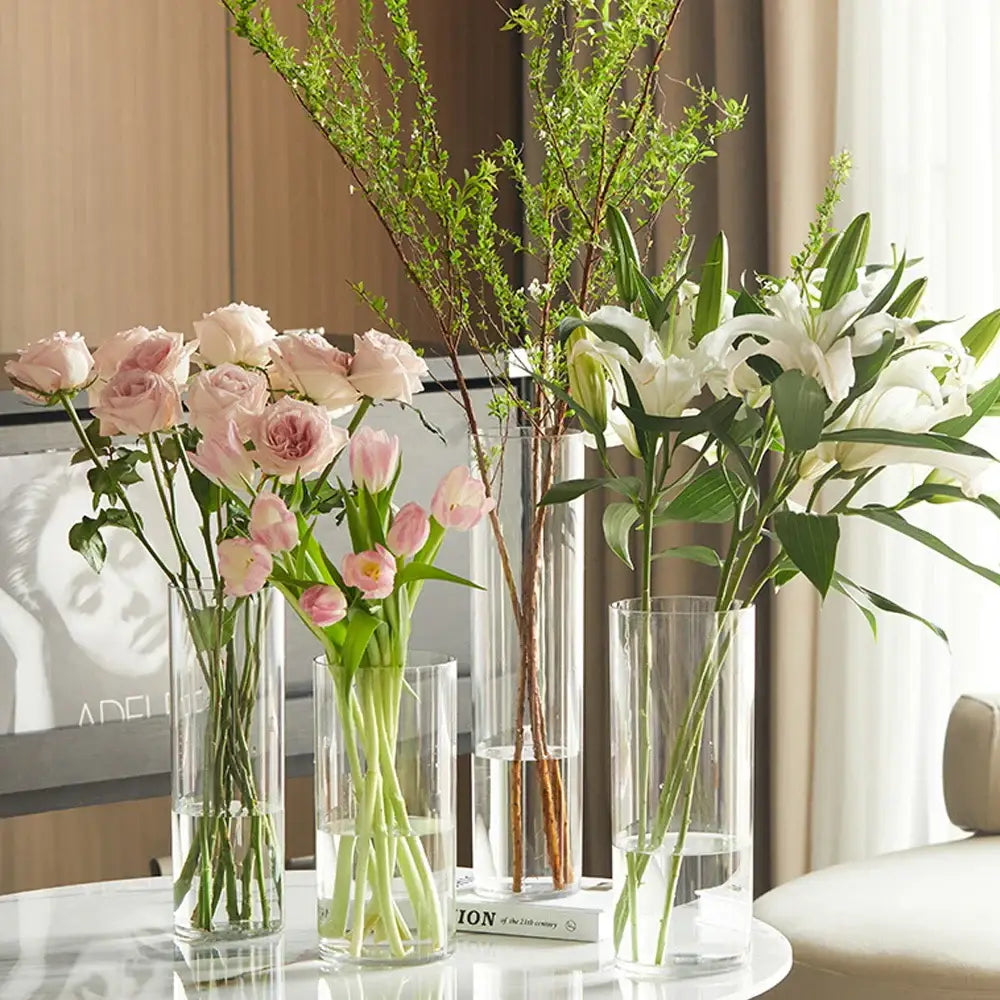 DecorBites™ clear acrylic cylinder vase holding pink roses tulips and white lilies for weddings