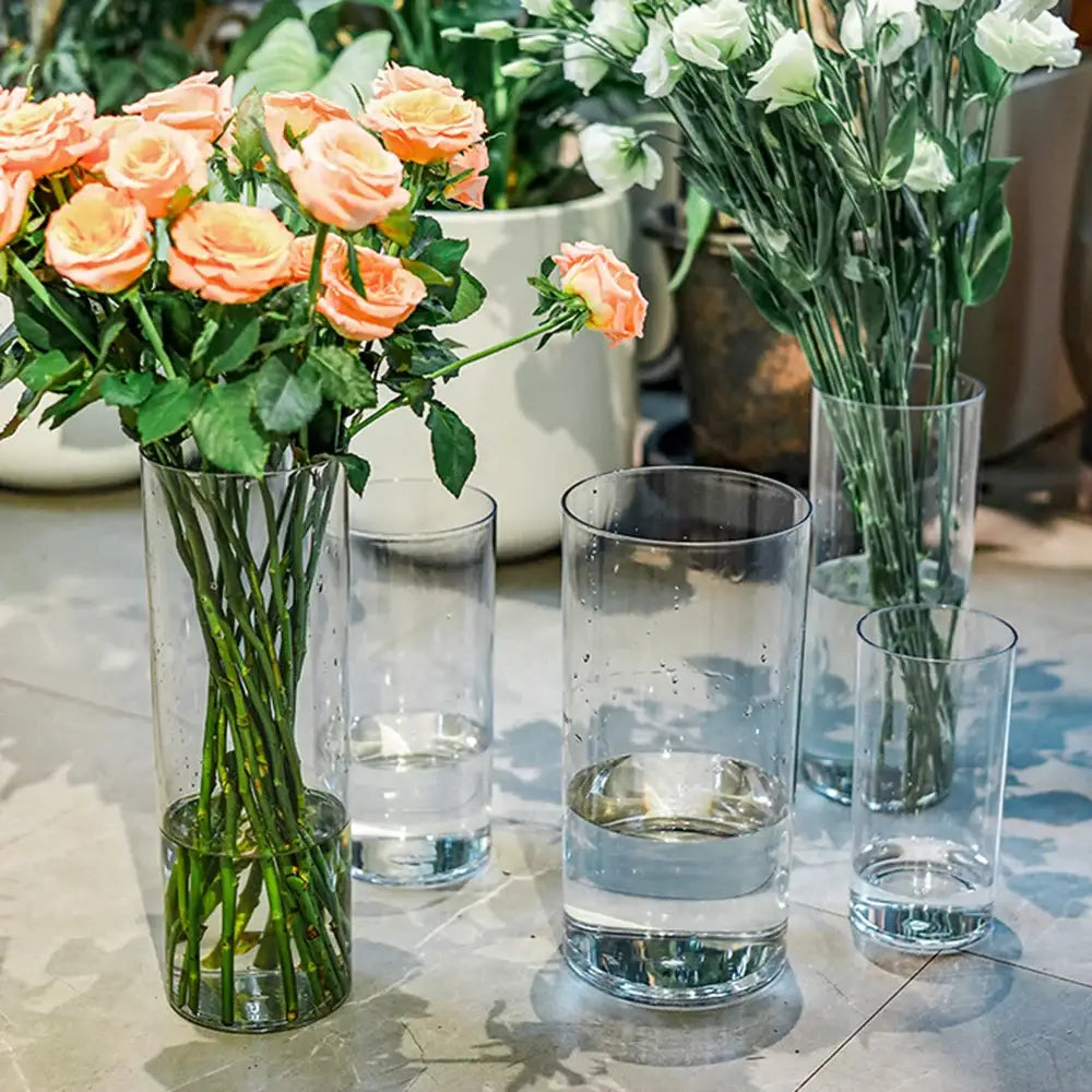 DecorBites clear acrylic cylinder vases in varying heights with peach roses for elegant wedding decor