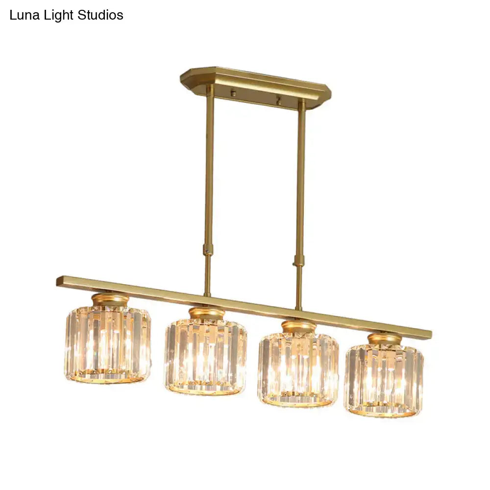Gold-finished metal island light with four clear crystal country cylinder hanging shades for elegant dining room decor