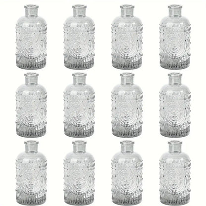 Decorbites clear glass bud vases set of 12 featuring intricate embossed circular patterns and gradient tint base