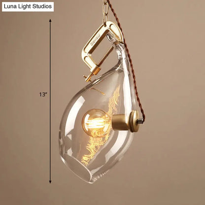 DecorBites™ clear glass fish pendant light with brass clamp and glowing Edison bulb for modern restaurant lighting