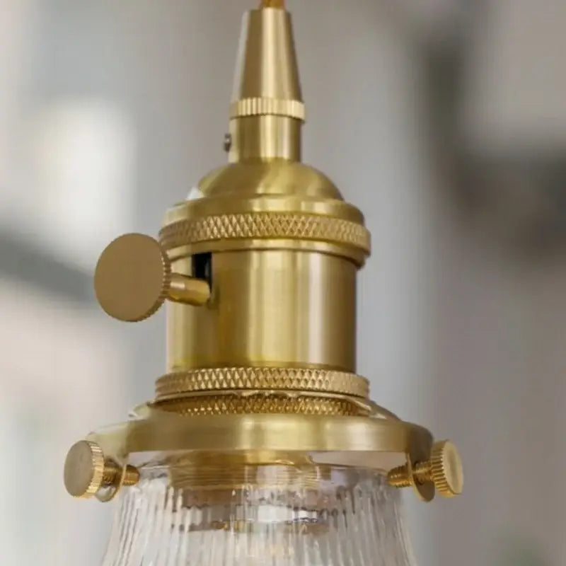 Brass-finished industrial pendant light with textured ridged bands and clear glass shade decorbites clear glass led pair for bedroom