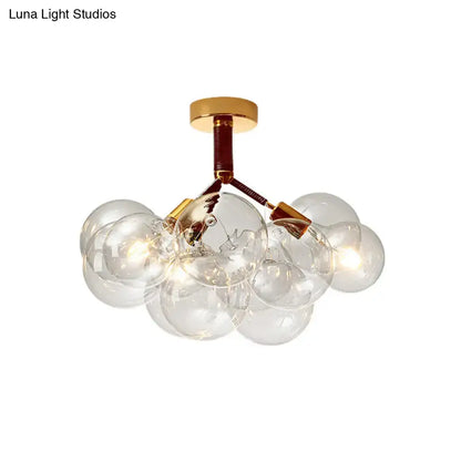 Modern DecorBites semi flush ceiling light with clear glass bubbles and brass accents for foyer and corridor illumination