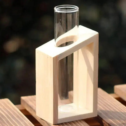 Clear glass test tube vase nestled in a minimalist light wood frame for DecorBites™ tube vases display