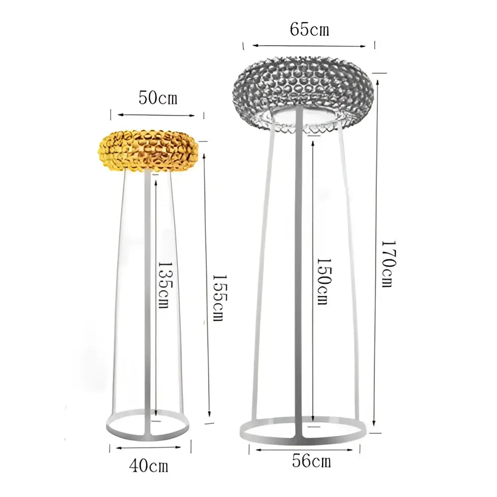 Decorbites clear gold acrylic pendant lights with gold and silver textured circular tops on tall slender metal stands